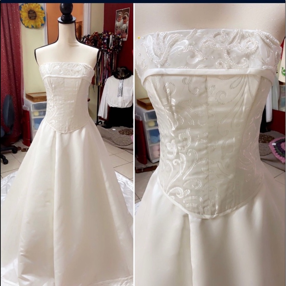 Two-piece, corset wedding dress! That’s a pure white ball gown!